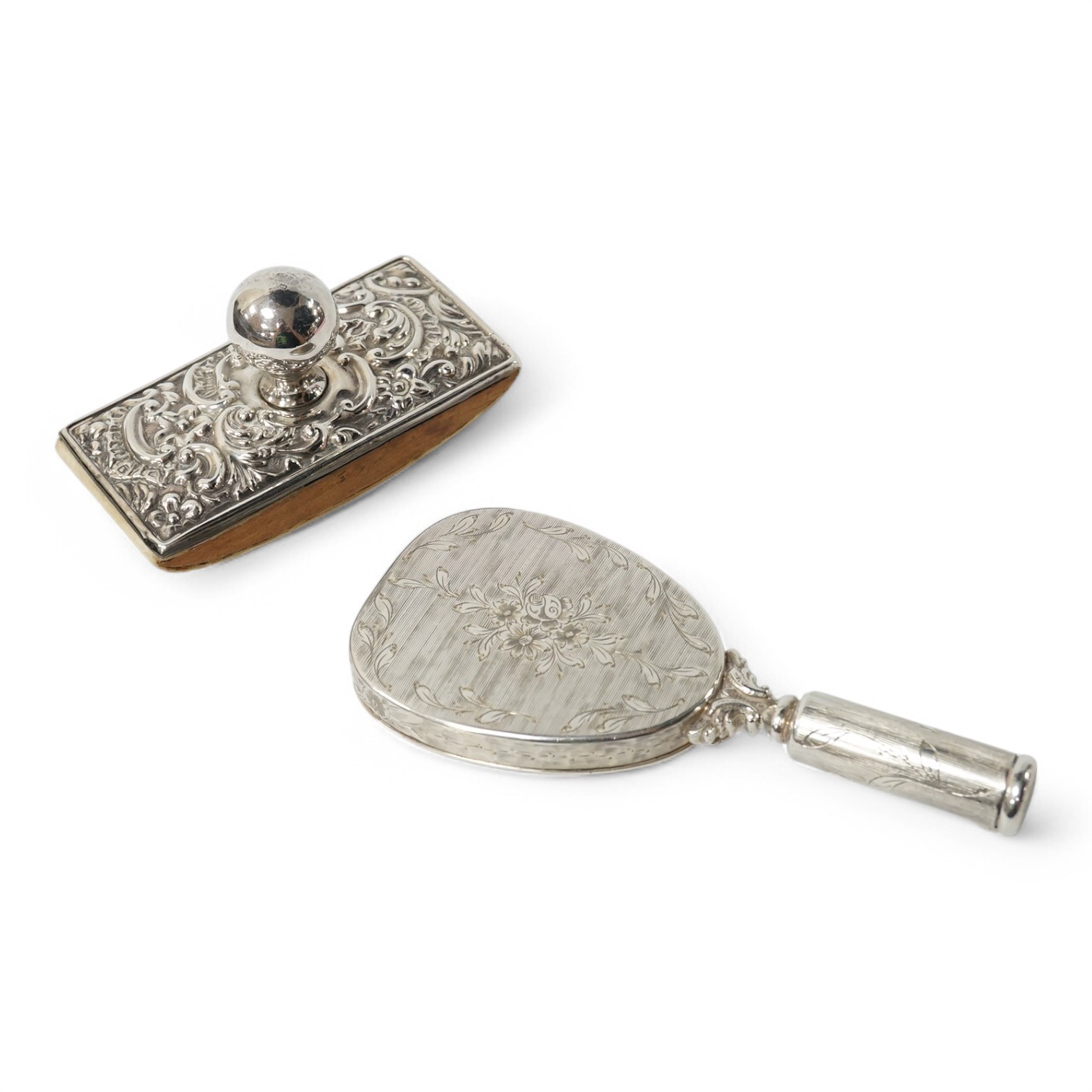 An early to mid 20th century continental white metal mounted combination compact and lipstick holder?, 14.2cm, together with an Edwardian repousse silver mounted blotter. Condition - poor to fair